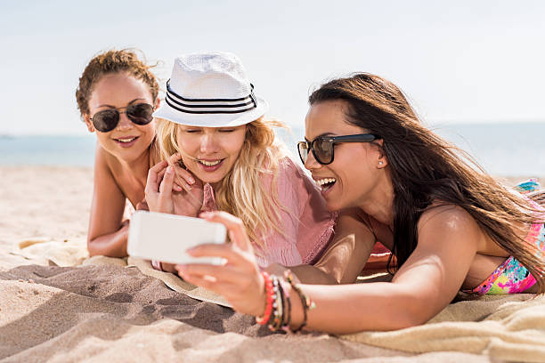 istock Happy women taking a selfie at the beach. 470125312