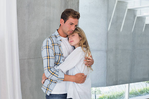 istock Loving young woman embracing man 470131222