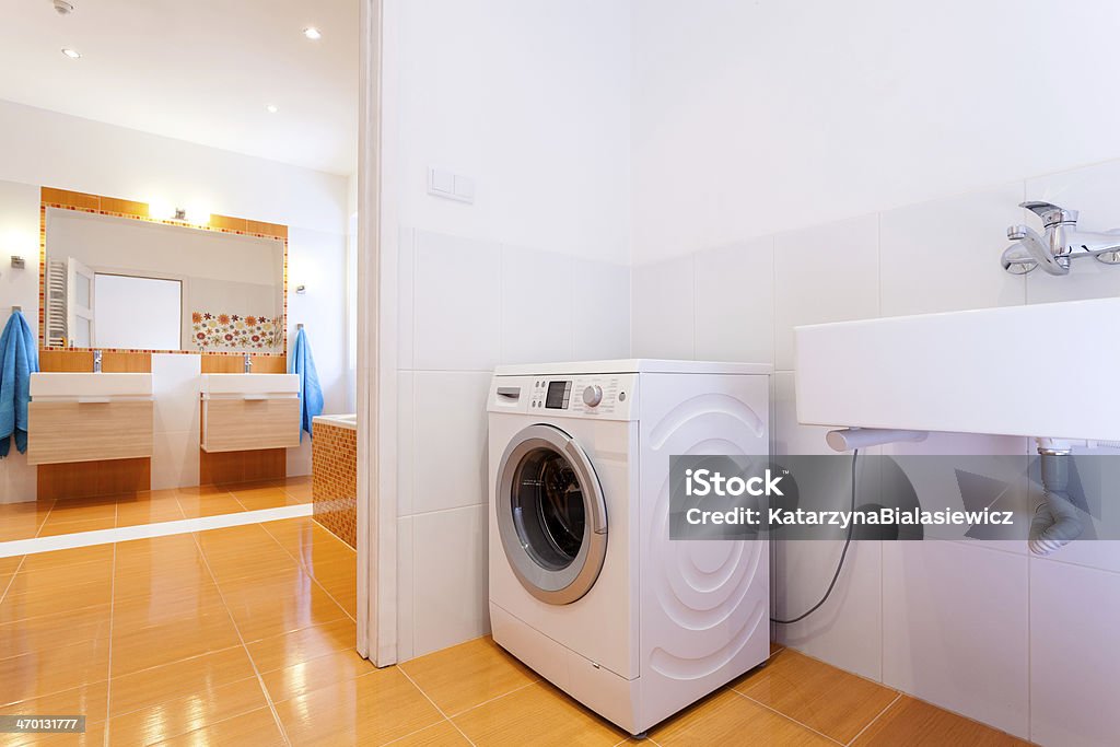 Big practical bathroom with washing machine Big comfortable practical bathroom with washing machine at big house Accessibility Stock Photo
