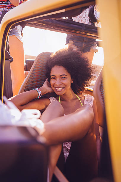 istock Afro girl on a summer vacation road trip 470134626
