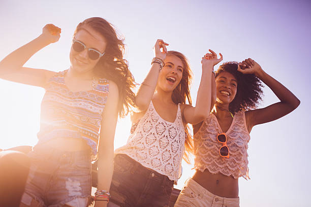 istock Dancing friends at the beach on a summer vacation 470134656