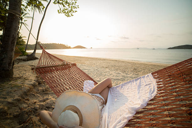istock Tropical vacation, woman on hammock 470135850