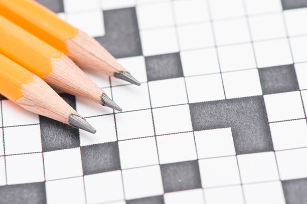 istock Crossword puzzle and pen 470140542