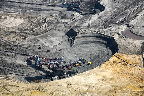 istock Large excavators in coal mine, aerial view 470141486