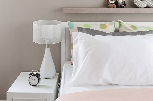 istock kid's bedroom with white pillows and lamp 470144850