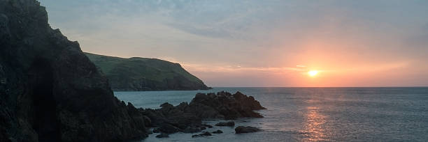 istock Panorama landscape vibrant sunset over rocky coastline 470147435