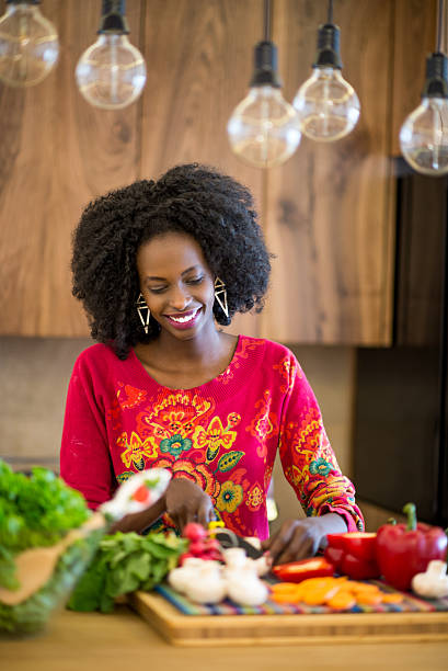 istock Woman cutting vegetables 470147958