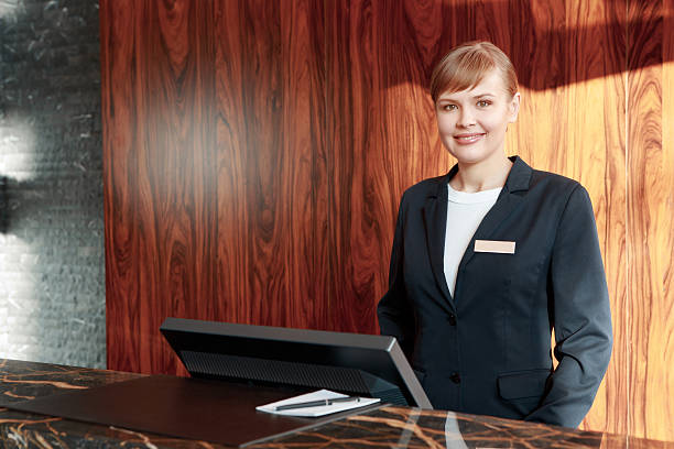 istock Hotel Receptionist Warmly Welcoming Guests 470148892