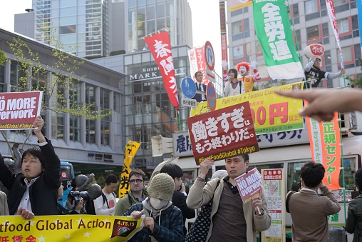 Tokyo,  Japan - April 15, 2015: Fast food workers protesting against harsh working conditions and low wages, as part of the global fast food workers' strike.