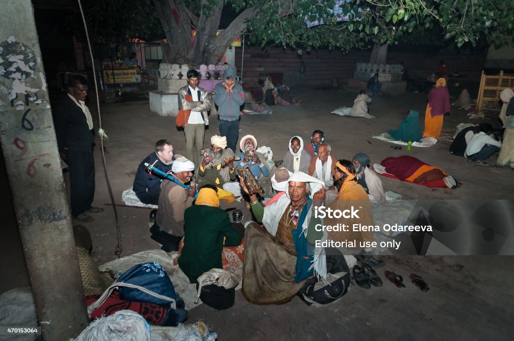 Group of Sadhus play in local musical instruments in Orchha Orchha, India - December 19, 2014: Group of Sadhus plays in local musical instruments in the central square at night. Orchha. Madhya Pradesh. India 2015 Stock Photo