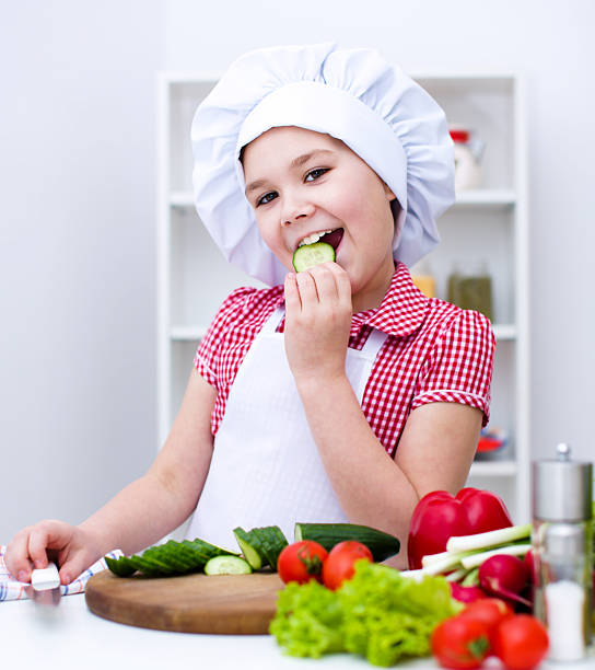 istock Girl eating salad 470153678
