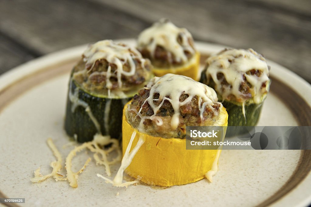 Courgettes stuffed with meat Yellow and green courgettes stuffed with minced pork and cheese. Gold Rush Courgette Stock Photo