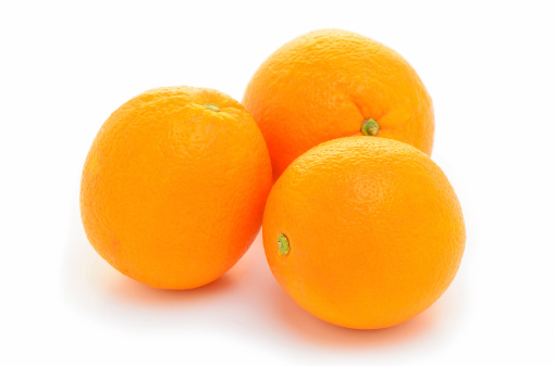 Organic navel oranges on white background