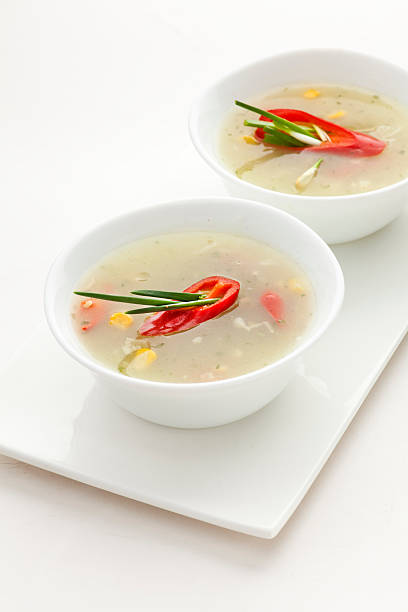 Sweet corn soup with chili peppers and spring onion stock photo