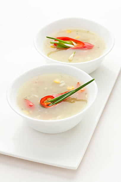 Sweet corn soup with chili peppers and spring onion stock photo