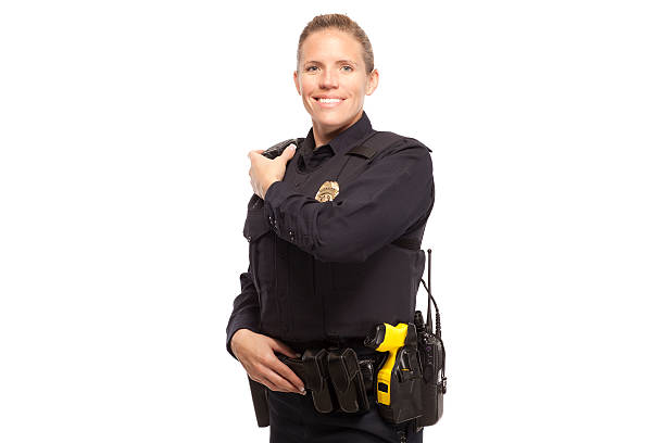 istock Smiling female officer with walkie talkie 470159912