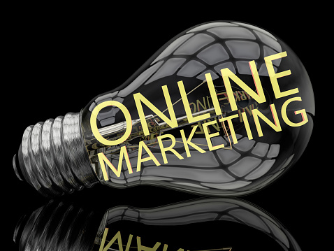 Online Marketing - lightbulb on black background with text in it. 3d render illustration.