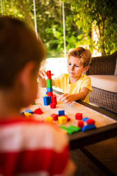 istock Boy playing with colurful educational building blocks 470163460