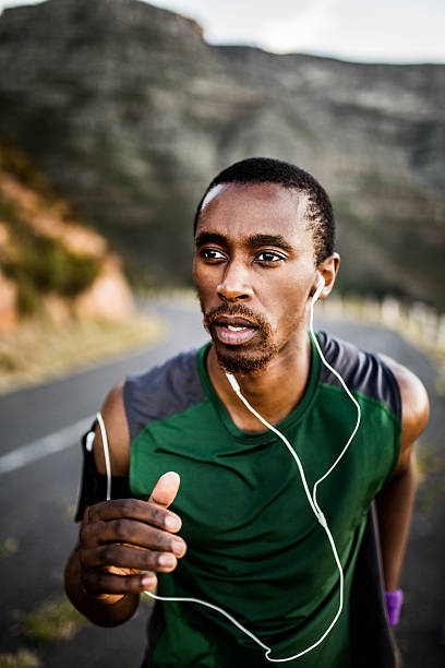 istock African American runner exercising while listening to music 470163602