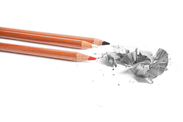 istock Black, white and red  pencils in white background 470164352