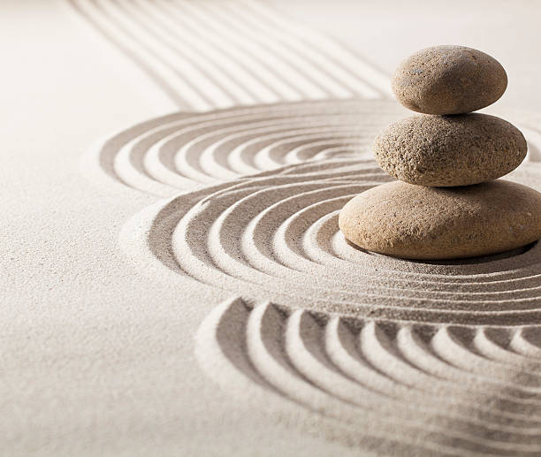 istock focus on balancing stones in sand for progression in life 470165153