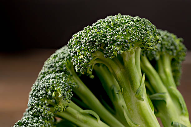 Fresh Raw Broccoli An extreme close up horizontal photograph of some fresh raw broccoli cruciferous vegetables stock pictures, royalty-free photos & images