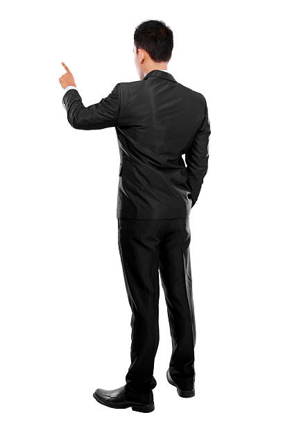 Businessman with hand pointing at a virtual screen businessman hand pushing virtual screen on white background human back stock pictures, royalty-free photos & images