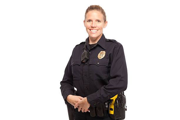 istock Female police officer posing against white background 470168192