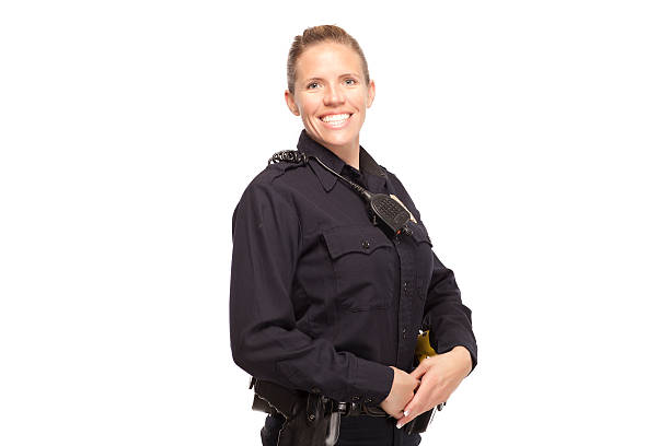 istock Female police officer with hands clasped 470168206