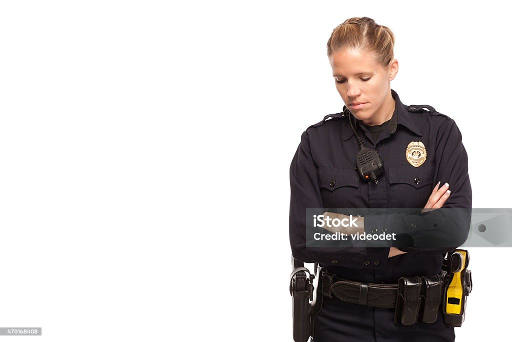 Sad female police officer Sad female police officer with arms crossed Police Force Stock Photo