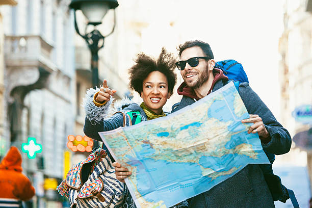 istock Young backpackers couple visiting the city 470169144