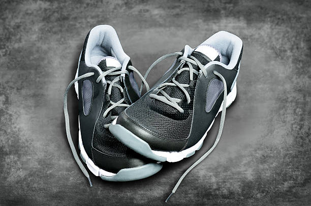 istock Black-and-white sneakers against a dark background 470171880