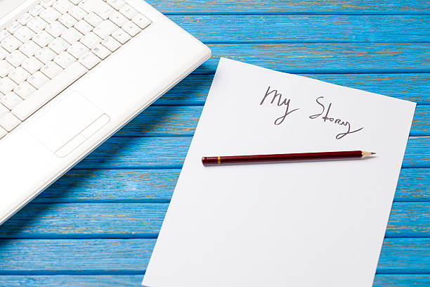 istock pencil and paper with My Story words near notebook 470172016