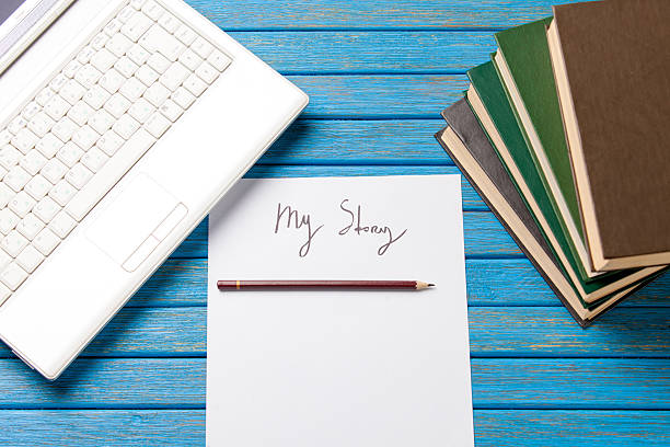 istock pencil and paper with My Story words near notebook 470172022