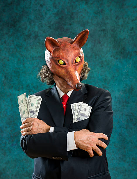 istock Rich business man wearing fox mask holding  banknotes 470172557