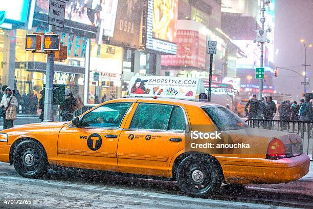 Yellow Taxi In Snow Blizzard On Times Square New York Stock Photo - Download Image Now