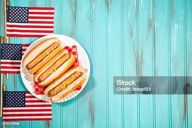Summer Holiday Picnic Hot Dogs Usa Flags Blue Wooden Table Stock Photo - Download Image Now