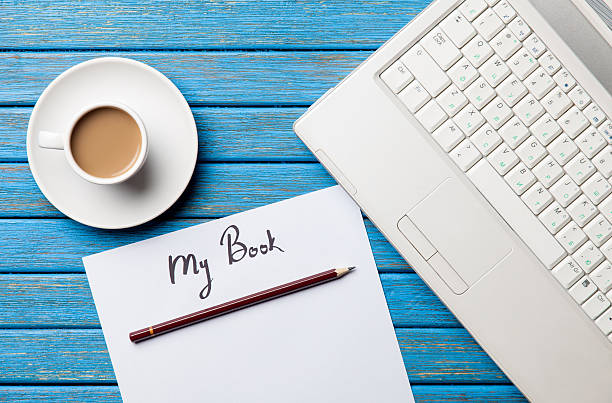 istock Coffee and paper with My Book inscription near notebook 470174472