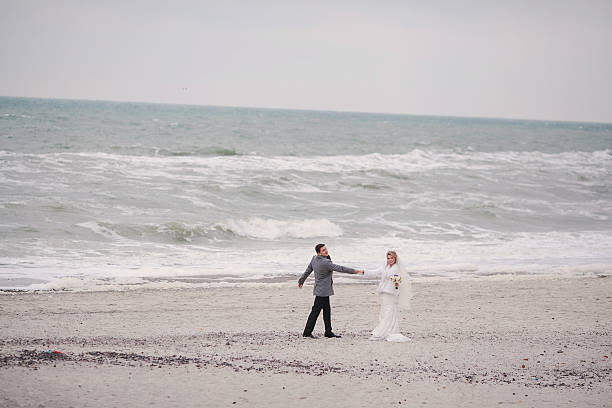 istock wedding on the beach in winter 470174774