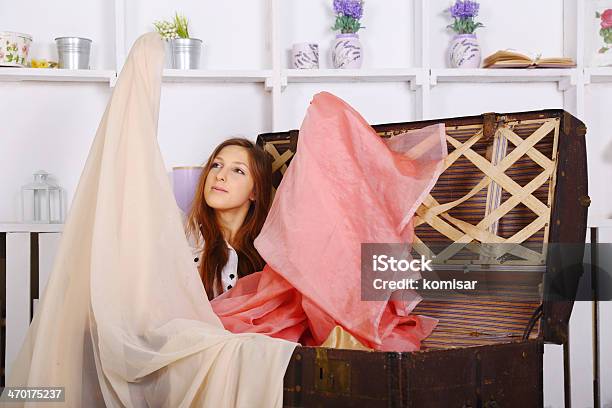 Girl And An Old Chest Of Fabrics Stock Photo - Download Image Now - Adult, Beautiful People, Beauty