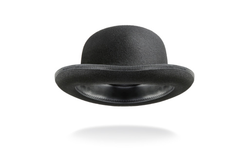 Bowler hat floating with drop shadow, isolated on white background.