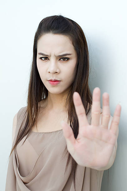 istock stop hand sign from beautiful woman 470176999