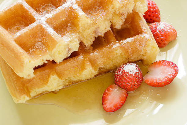 istock Closeup waffle with syrup and strawberries,breakfast. 470177235