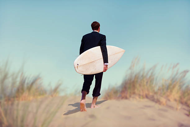 istock Businessman with Surfboard Going to the Beach 470180660