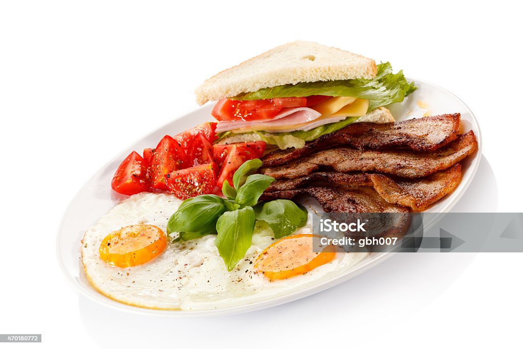 Breakfast - fried eggs, bacon and vegetables English breakfast 2015 Stock Photo