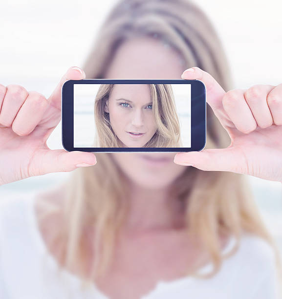 istock Composite image of hands holding smartphone 470181902