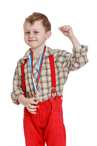 istock Funny little boy in red shorts with straps 470182894