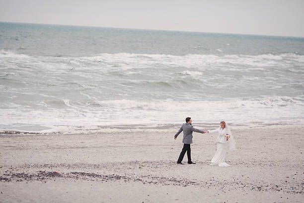 istock wedding on the beach in winter 470186206