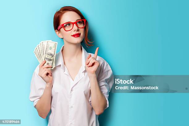 Woman Wearing Red Glasses With Money In Her Hand Stock Photo - Download Image Now - Currency, Dollar Sign, Women