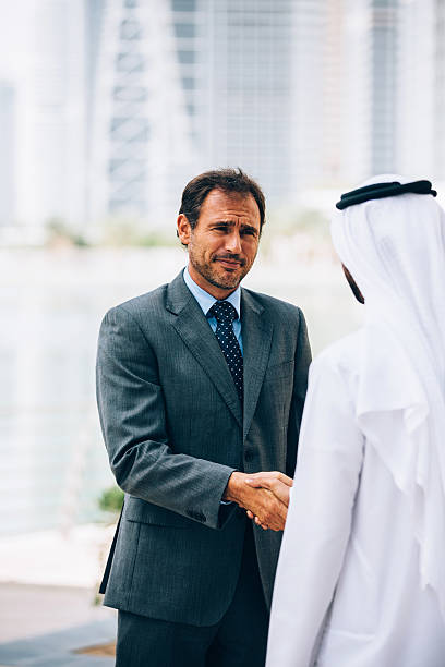 istock Businessmen in Dubai handshake 470189974